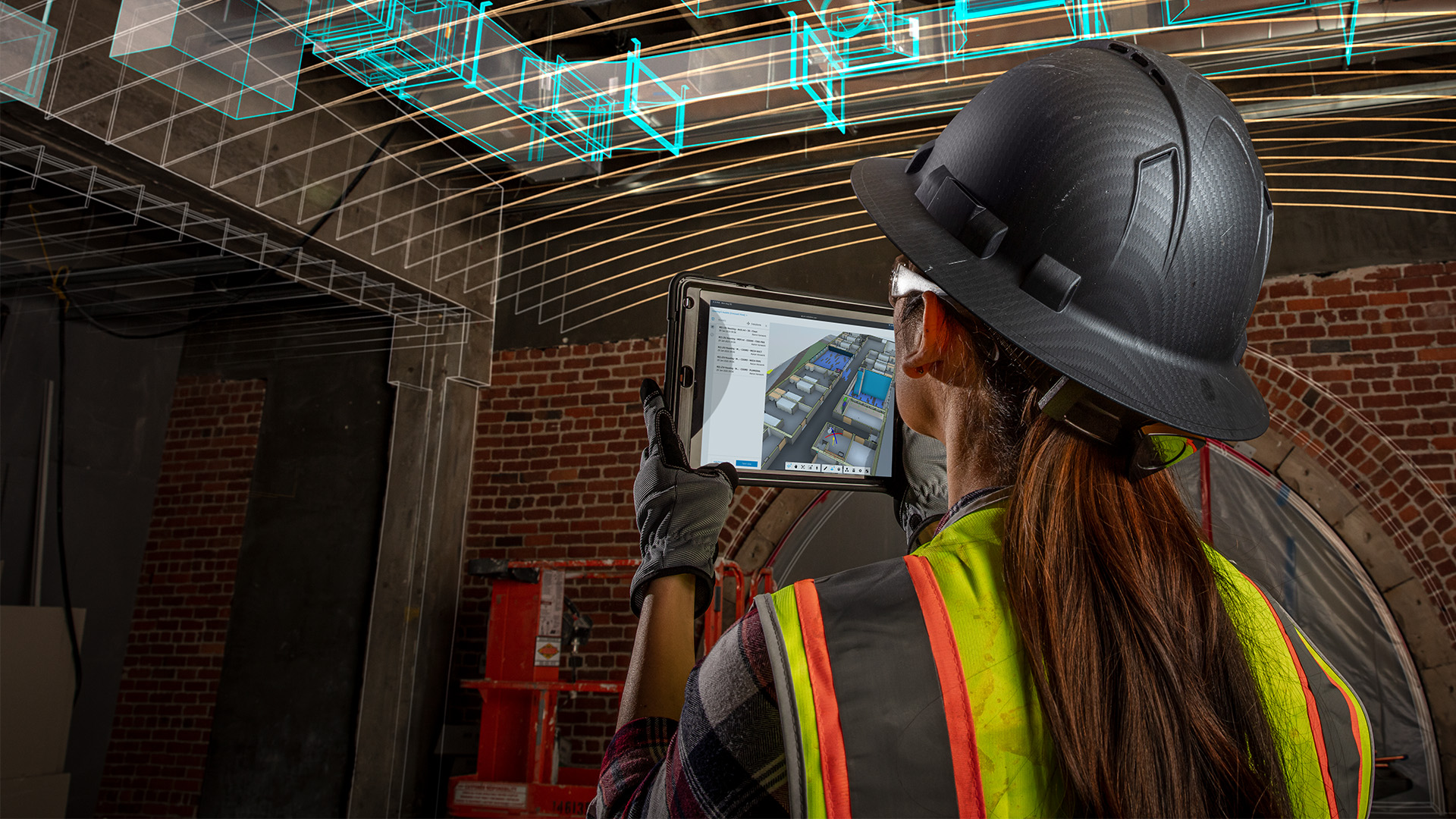 Construction worker reviewing a 3D model on a tablet